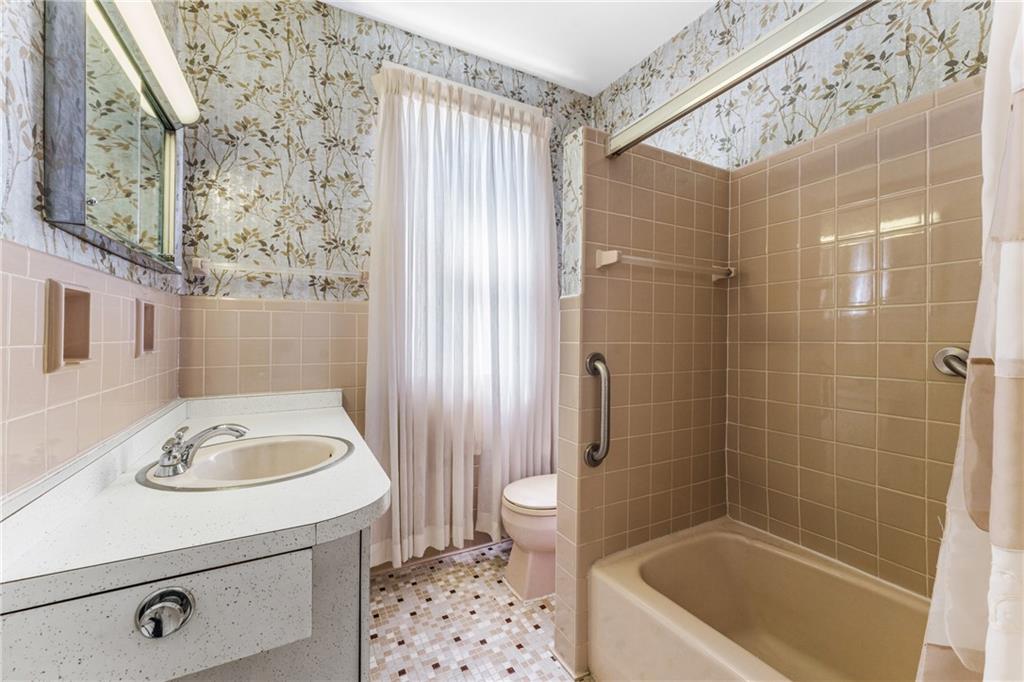 111 Sarah Street McKees Rocks, PA 15136 - Photo 15 of 30 a bathroom with a sink a toilet and shower