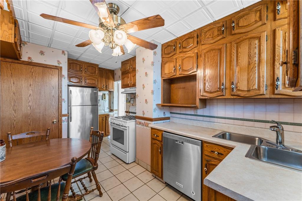 111 Sarah Street McKees Rocks, PA 15136 - Photo 5 of 30 a kitchen with a sink appliances and cabinets