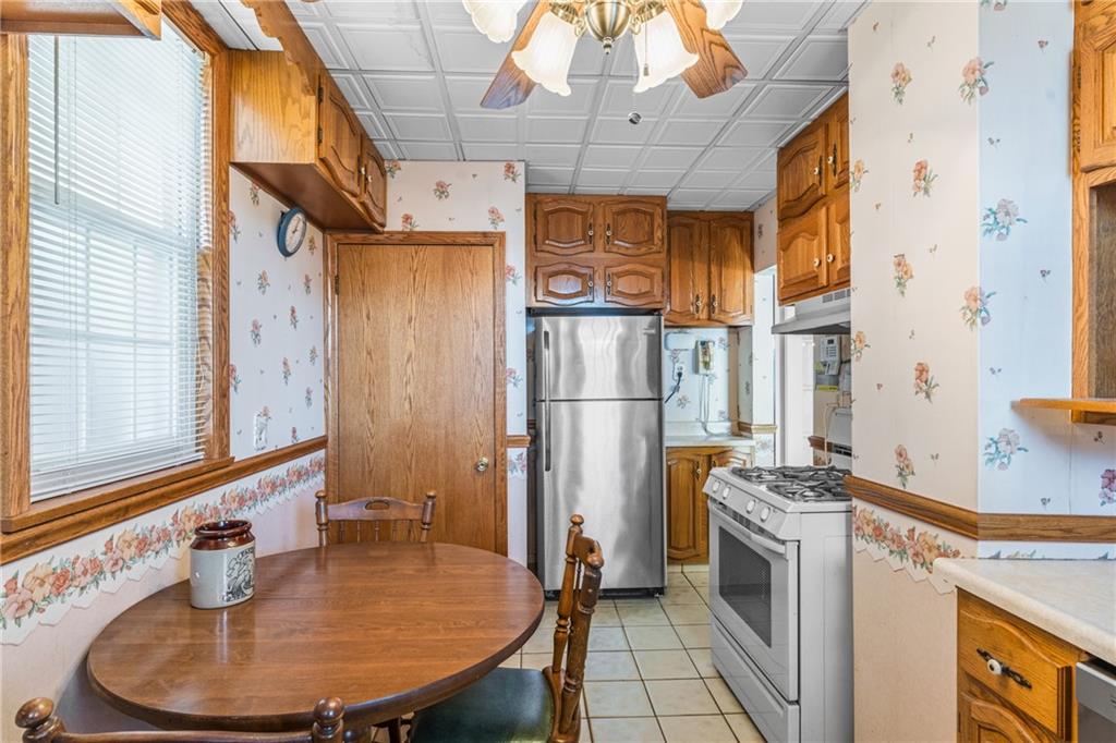 111 Sarah Street McKees Rocks, PA 15136 - Photo 7 of 30 a view of a kitchen with a stove and a window