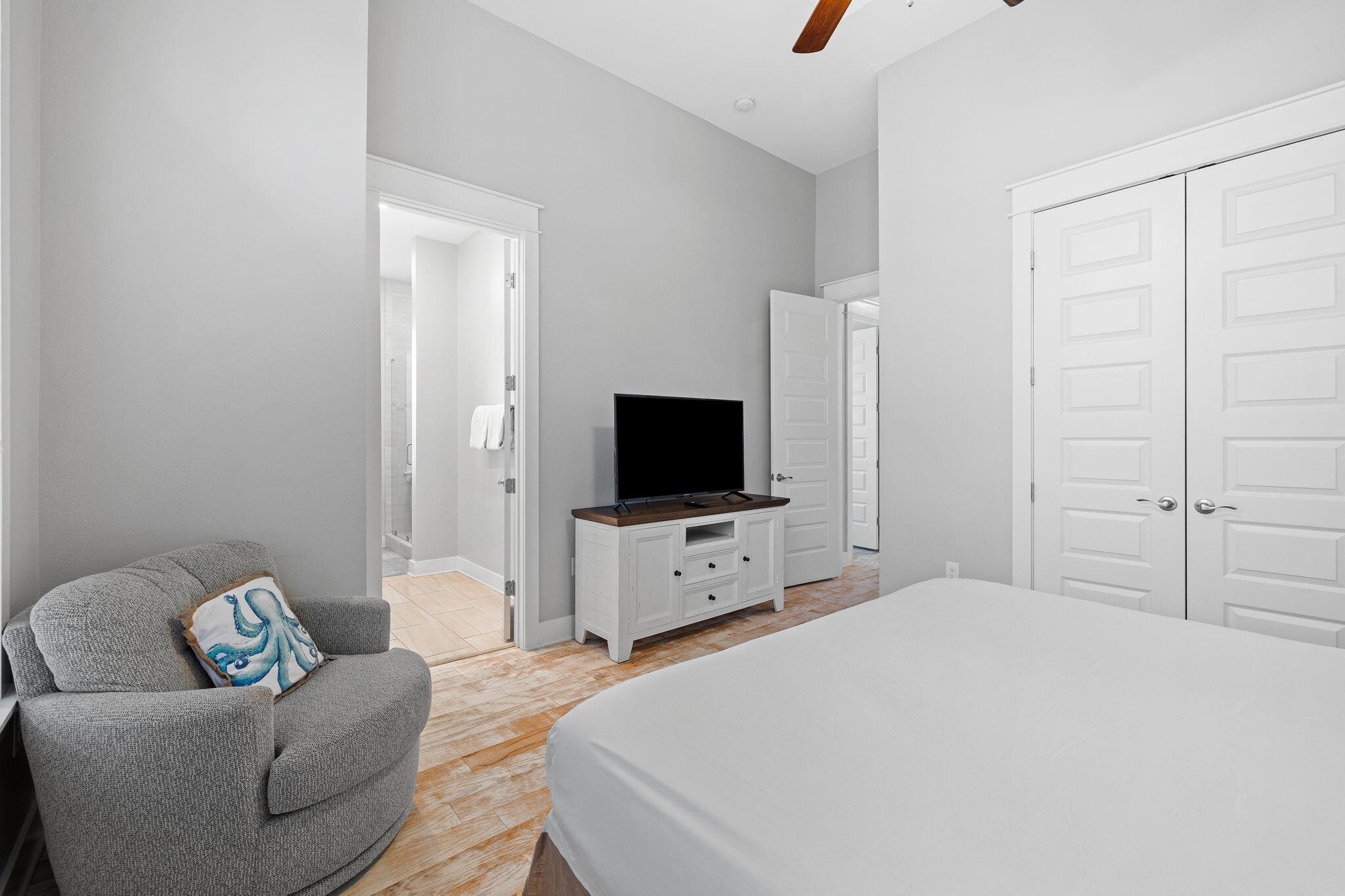 223 Milestone Dr Inlet Beach, Unit B Inlet Beach, FL 32461 - Photo 18 of 58 a bedroom with a bed and a flat screen tv