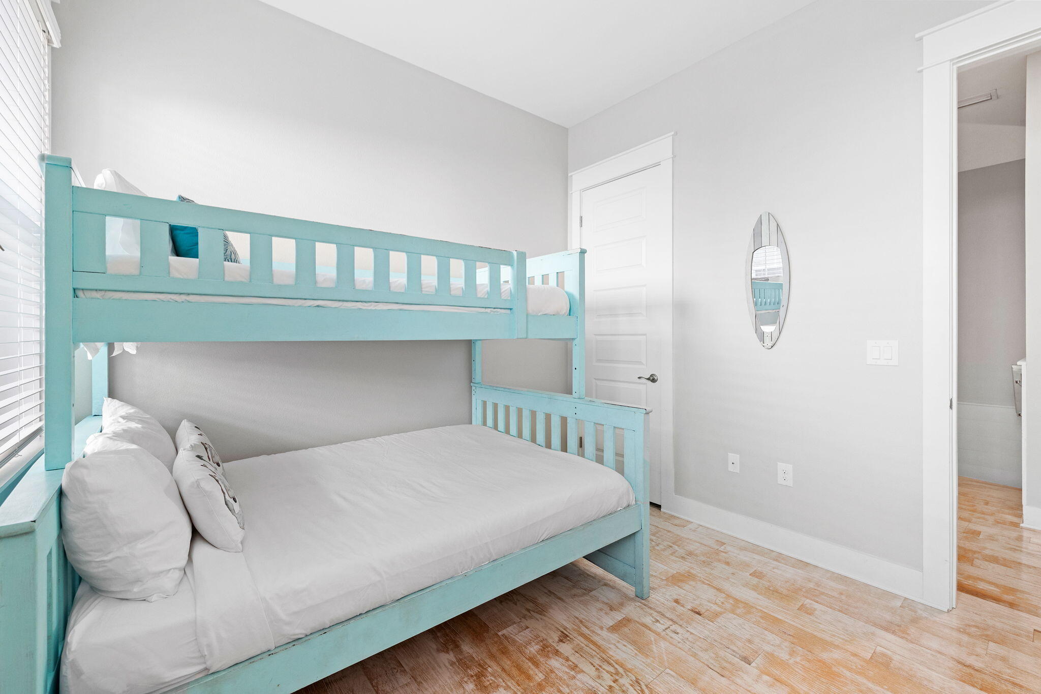 223 Milestone Dr Inlet Beach, Unit B Inlet Beach, FL 32461 - Photo 22 of 58 a bedroom with a bed and a window