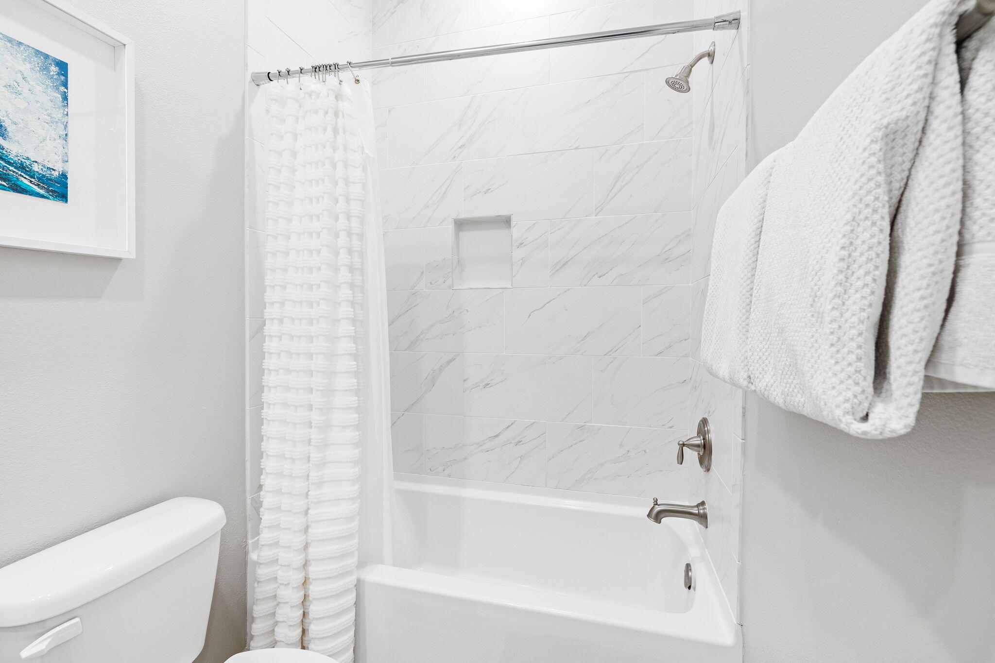 223 Milestone Dr Inlet Beach, Unit B Inlet Beach, FL 32461 - Photo 26 of 58 a bathroom with a shower curtain and a toilet