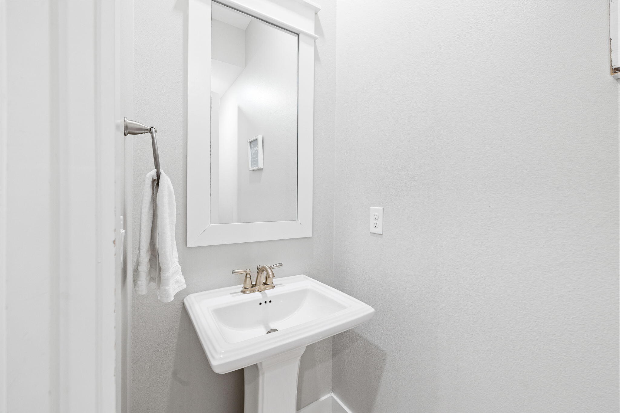 223 Milestone Dr Inlet Beach, Unit B Inlet Beach, FL 32461 - Photo 28 of 58 a bathroom with a sink and a mirror