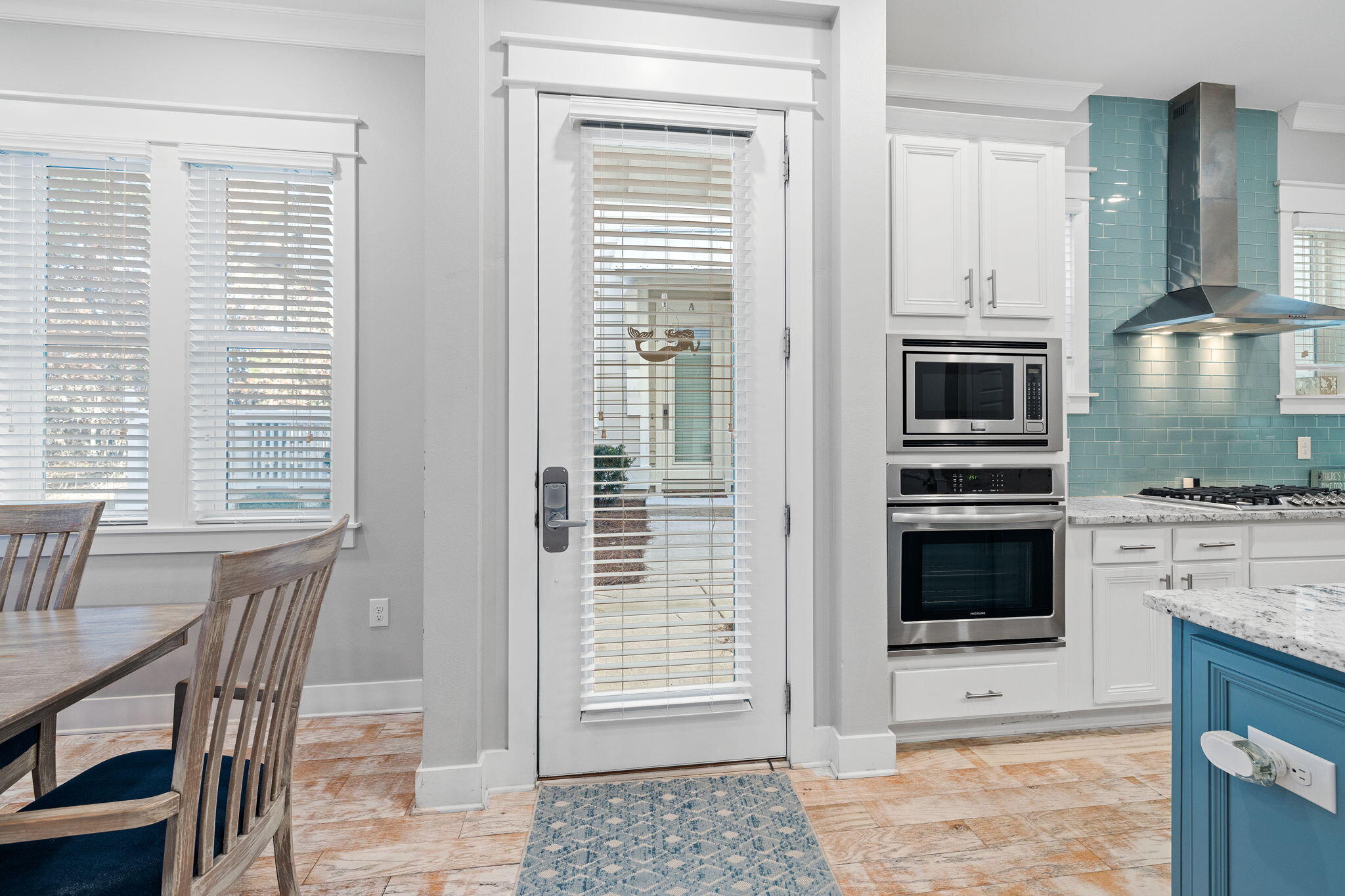 223 Milestone Dr Inlet Beach, Unit B Inlet Beach, FL 32461 - Photo 29 of 58 a kitchen with a stove a sink and a microwave