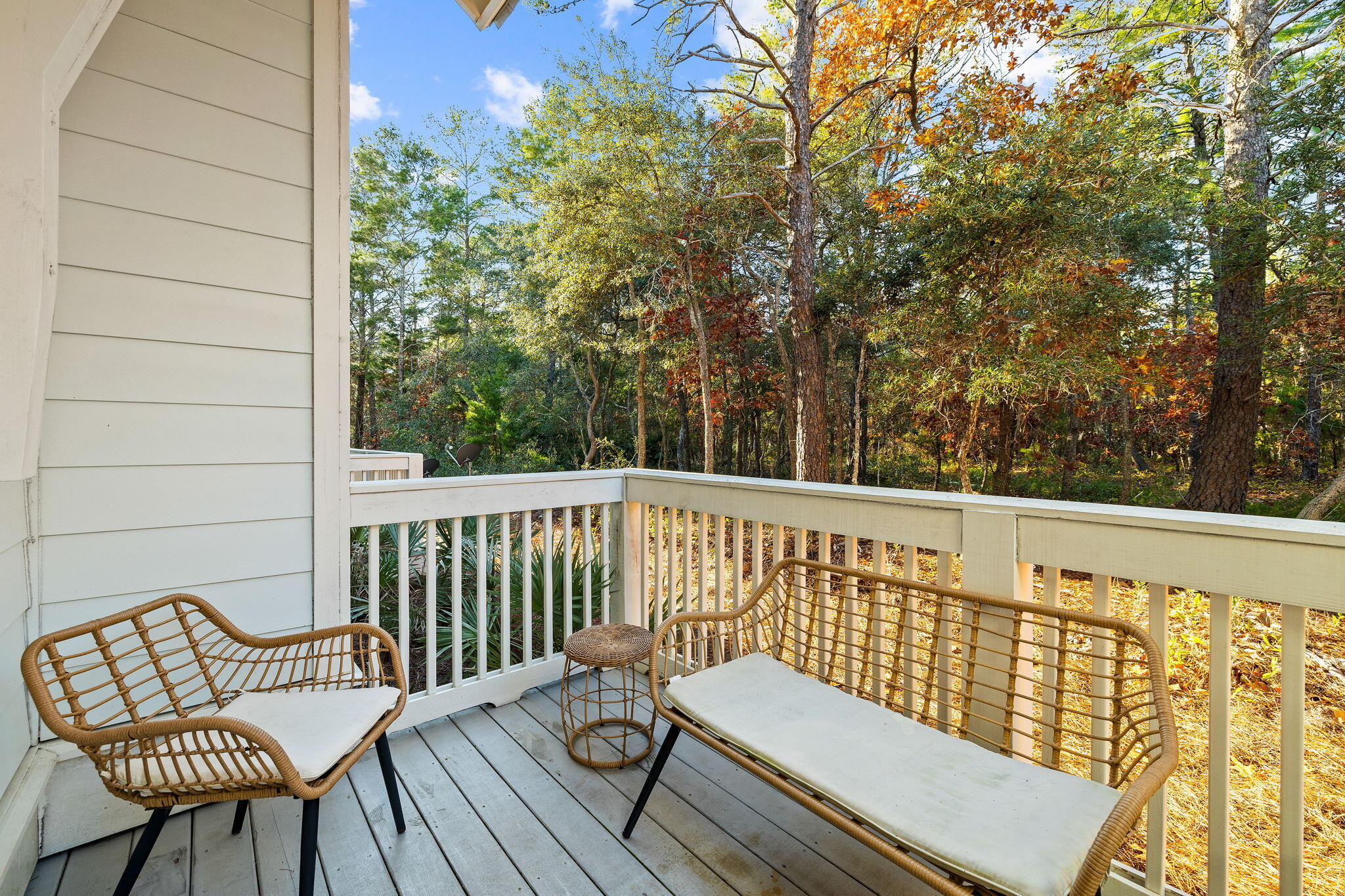 223 Milestone Dr Inlet Beach, Unit B Inlet Beach, FL 32461 - Photo 31 of 58 a view of a chair in wooden deck