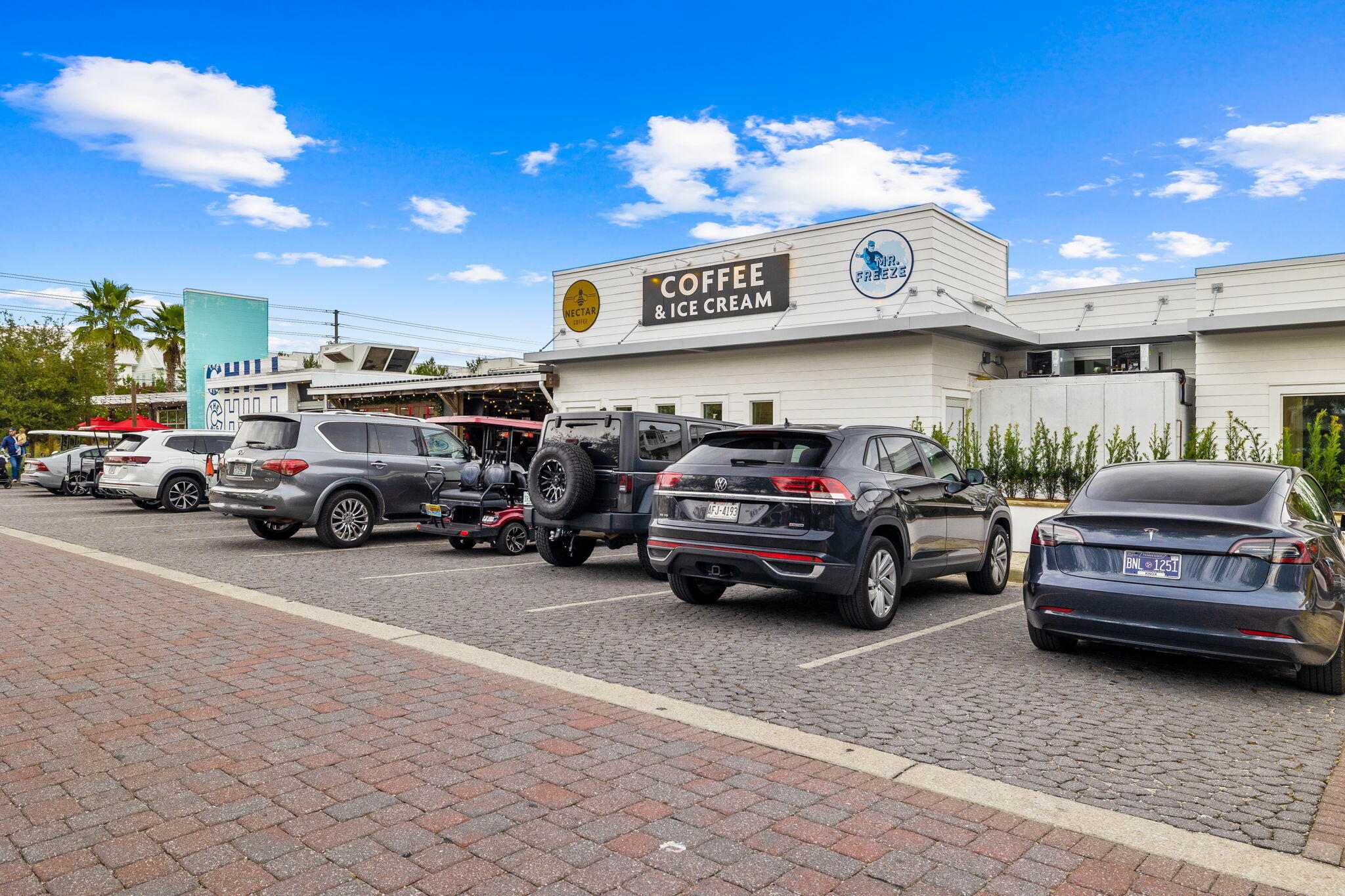 223 Milestone Dr Inlet Beach, Unit B Inlet Beach, FL 32461 - Photo 53 of 58 a view of a cars park in front of a building