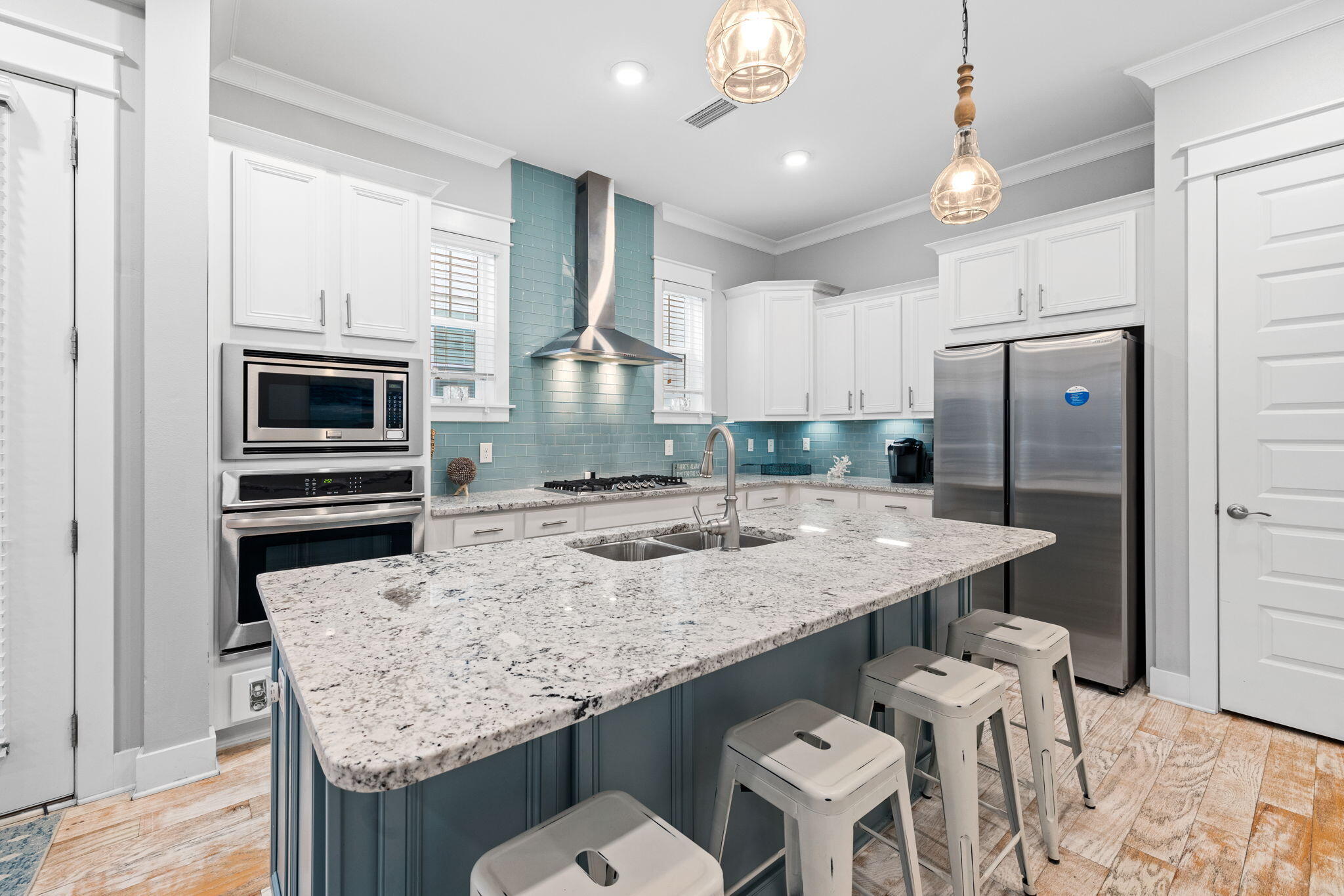 223 Milestone Dr Inlet Beach, Unit B Inlet Beach, FL 32461 - Photo 9 of 58 a kitchen with granite countertop kitchen island a sink stove and refrigerator