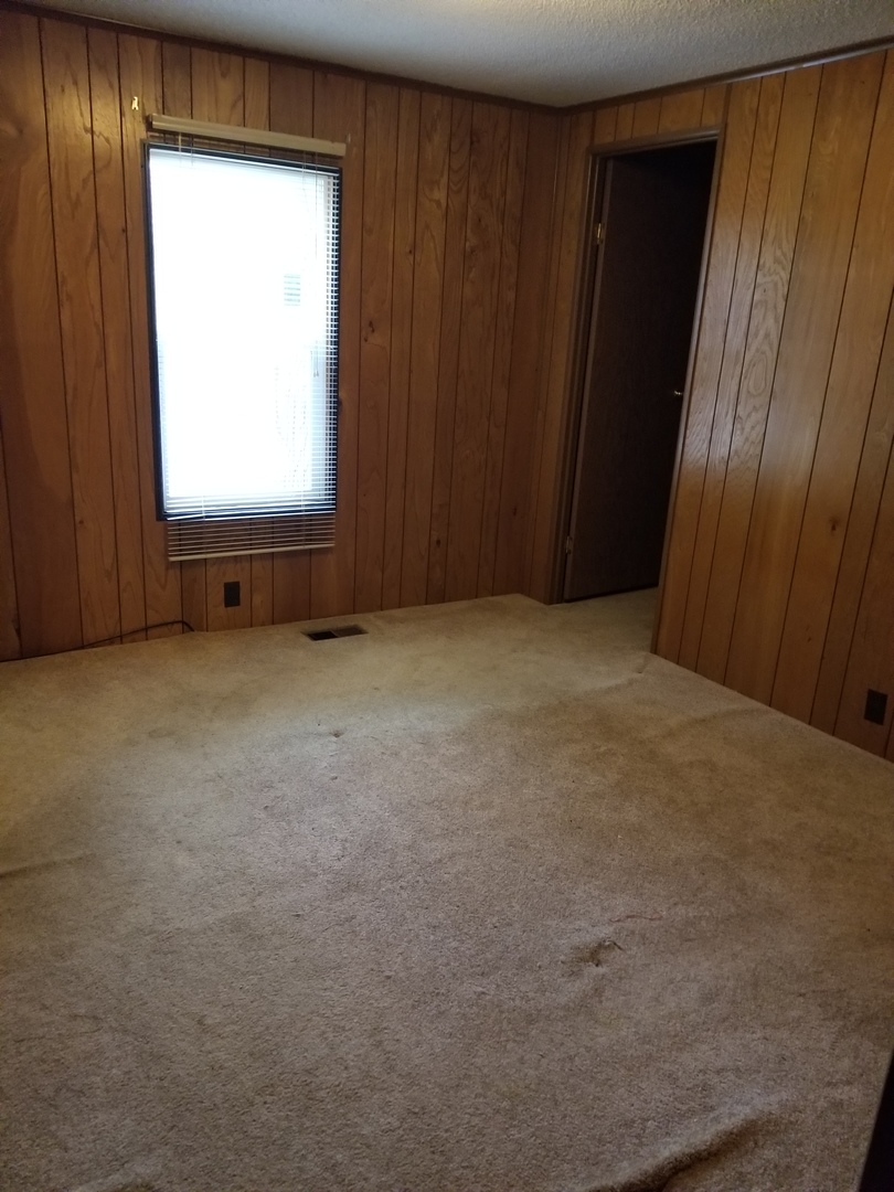 259 Parkwood Road Elgin, IL 60123 - Photo 11 of 18 an empty room with windows