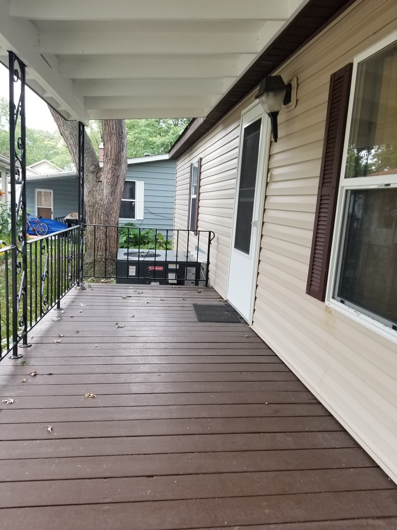 259 Parkwood Road Elgin, IL 60123 - Photo 4 of 18 a view of outdoor space with deck and patio