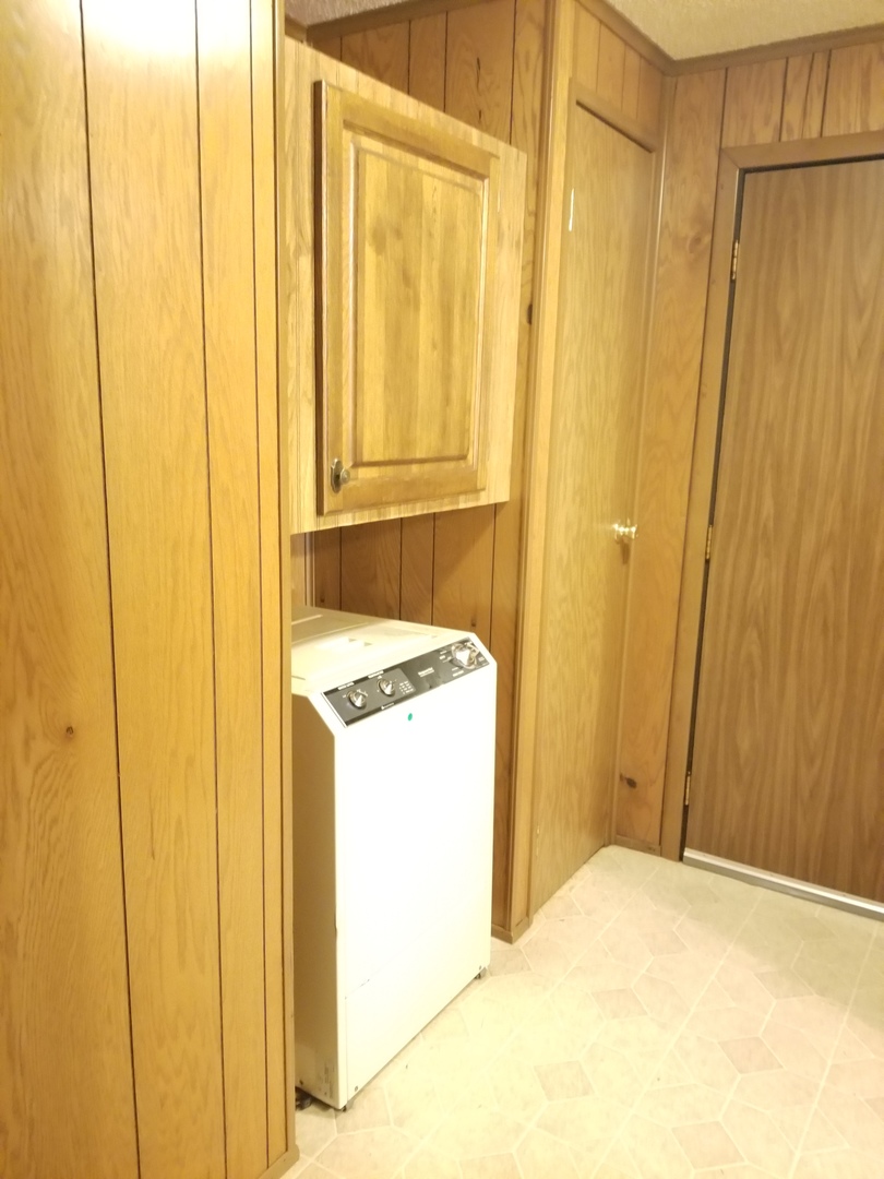 259 Parkwood Road Elgin, IL 60123 - Photo 9 of 18 a bathroom with a granite countertop sink and a mirror