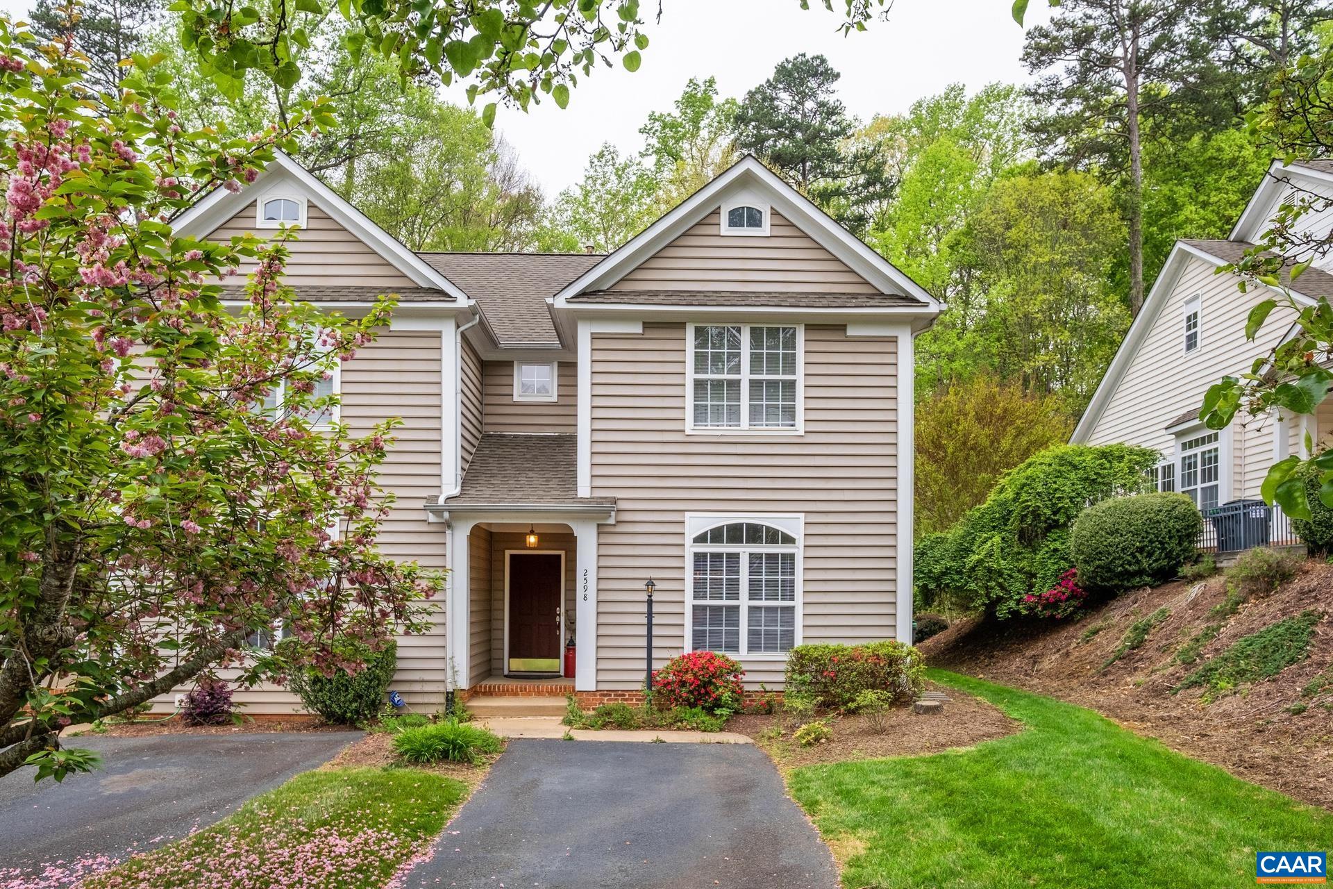2598 Ravenscroft Way Charlottesville, VA 22911 - Photo 1 of 17 a front view of a house with garden
