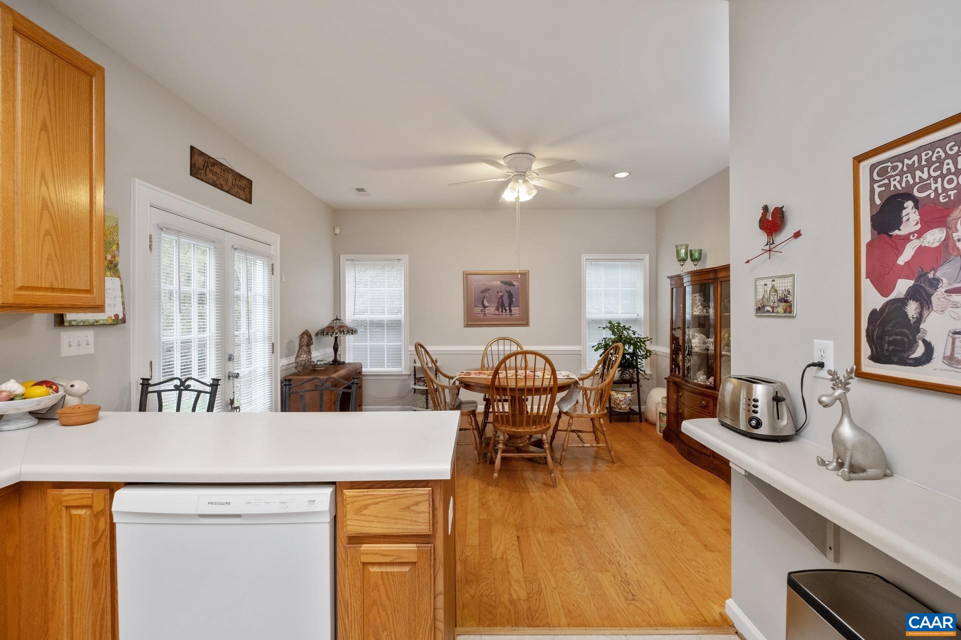2598 Ravenscroft Way Charlottesville, VA 22911 - Photo 4 of 17 a view of a dining room with furniture and wooden floor