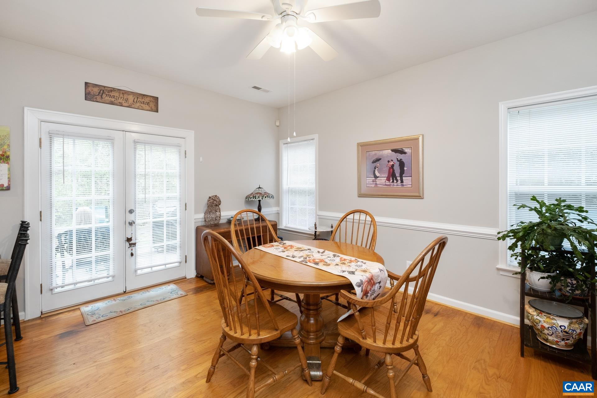 2598 Ravenscroft Way Charlottesville, VA 22911 - Photo 5 of 17 a view of a dining room with furniture and a potted plant