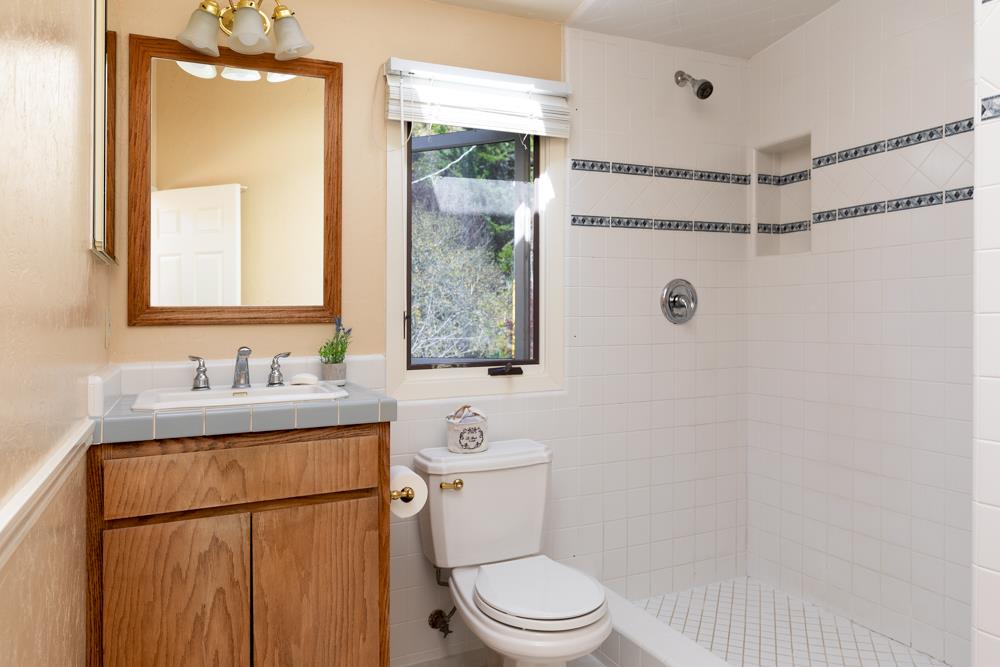 223 Nehf Lane Soquel, CA 95073 - Photo 16 of 34 a bathroom with a granite countertop sink mirror vanity and toilet