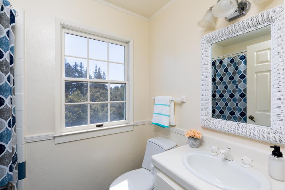223 Nehf Lane Soquel, CA 95073 - Photo 18 of 34 a bathroom with a sink a toilet and shower curtain
