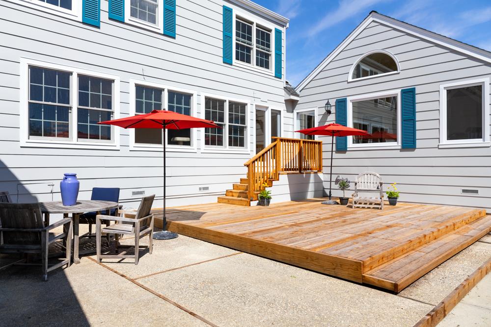 223 Nehf Lane Soquel, CA 95073 - Photo 21 of 34 a view of a patio with a table and chairs under an umbrella