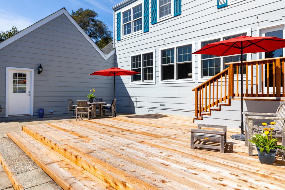 223 Nehf Lane Soquel, CA 95073 - Photo 22 of 34 a view of a patio with a table and chairs under an umbrella