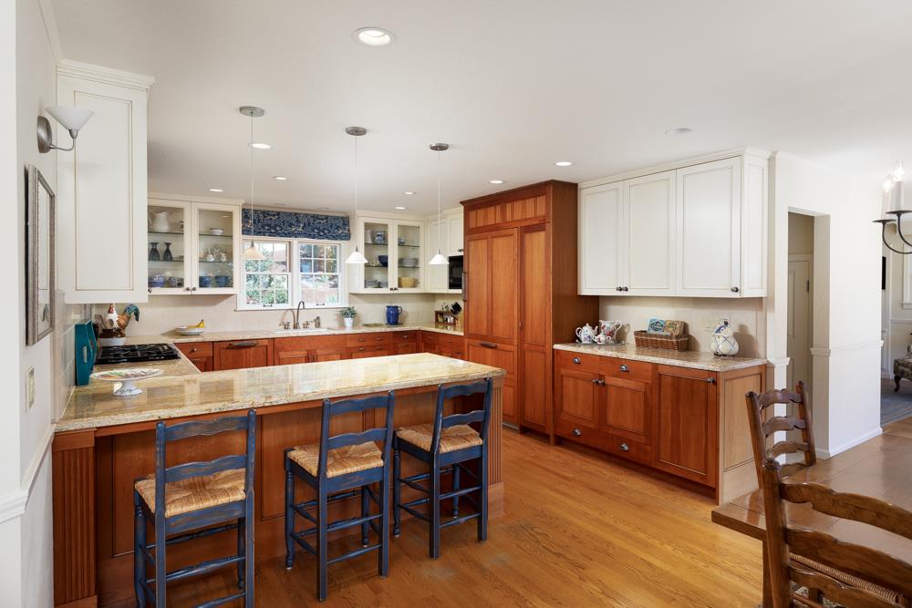 223 Nehf Lane Soquel, CA 95073 - Photo 7 of 34 a kitchen with stainless steel appliances granite countertop a dining table chairs refrigerator and cabinets