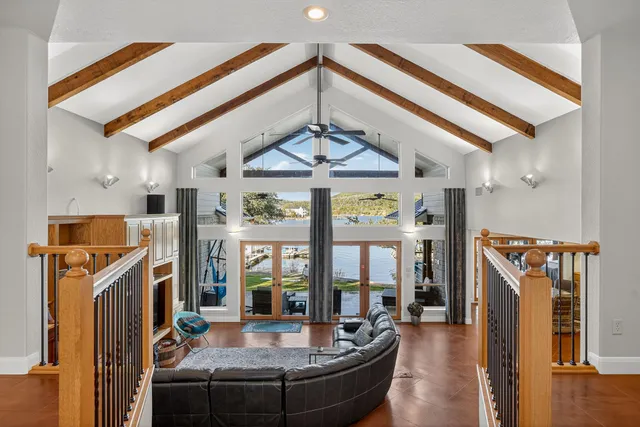 a view of a living room with furniture and fireplace