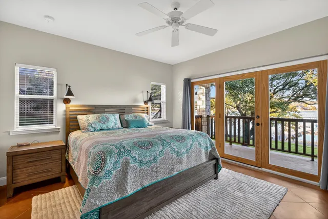 a bedroom with a large bed and a window