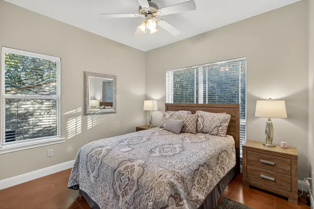 a bedroom with a bed and a night stand