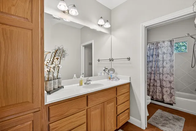 a bathroom with a sink double vanity and a mirror