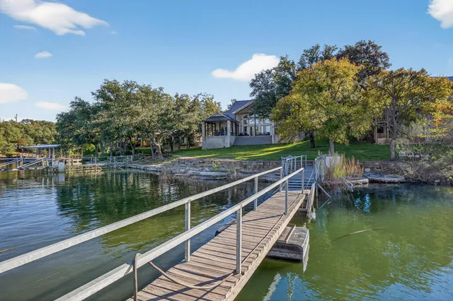 a view of wooden house with a lake view