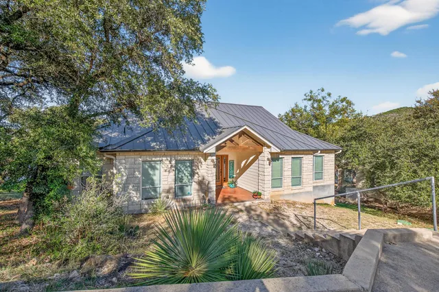 a house with a tree in front of it