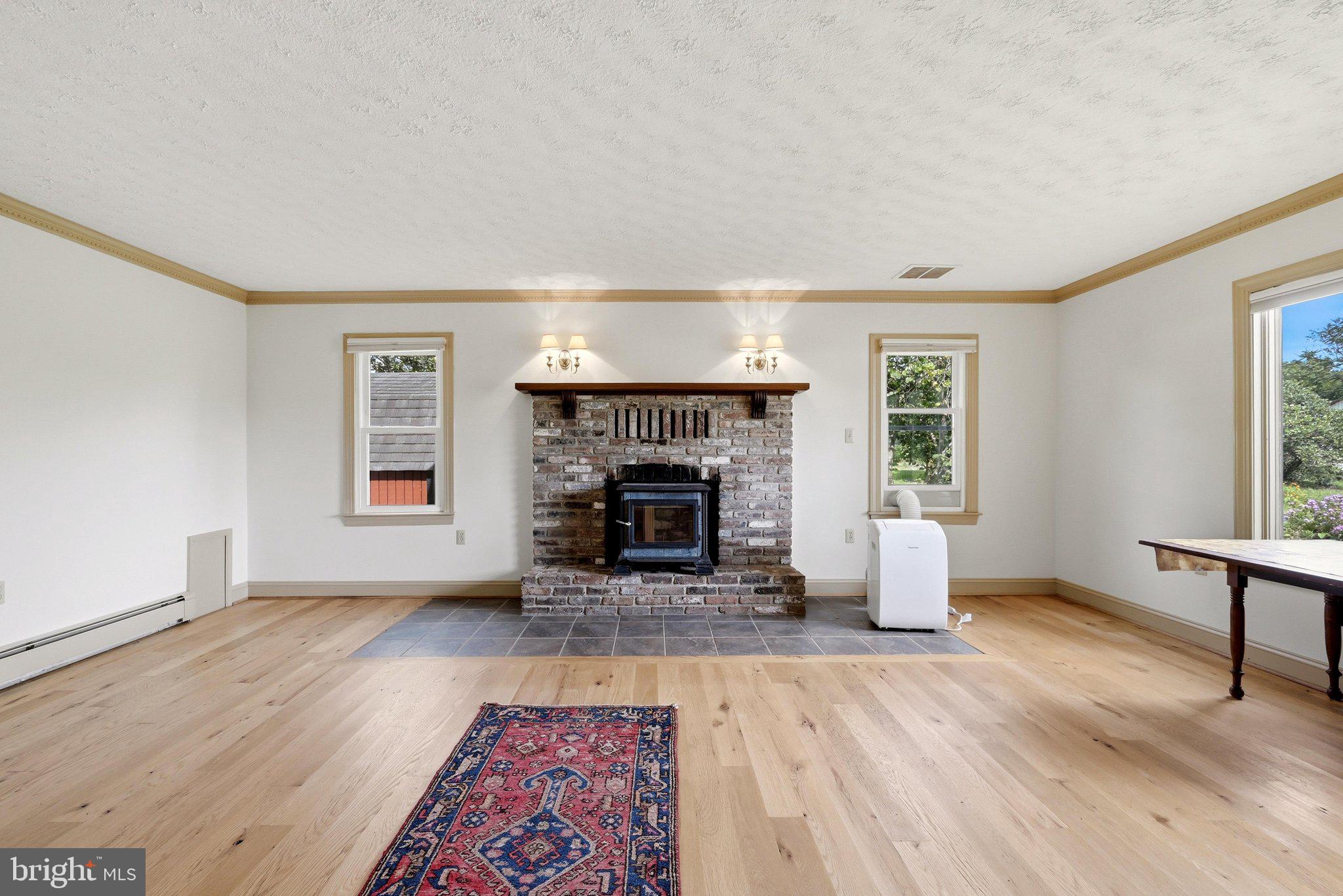936 Gun Barrel Road White Post, VA 22663 - Photo 32 of 106 Living Room With Milled Barn Boards for The Floor