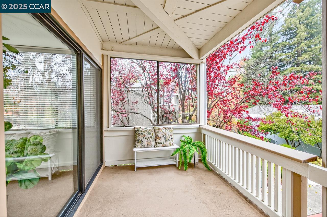 1400 Ptarmigan Drive, Unit 2 Walnut Creek, CA 94595 - Photo 28 of 44 a front view of a house with outdoor seating and a potted plant