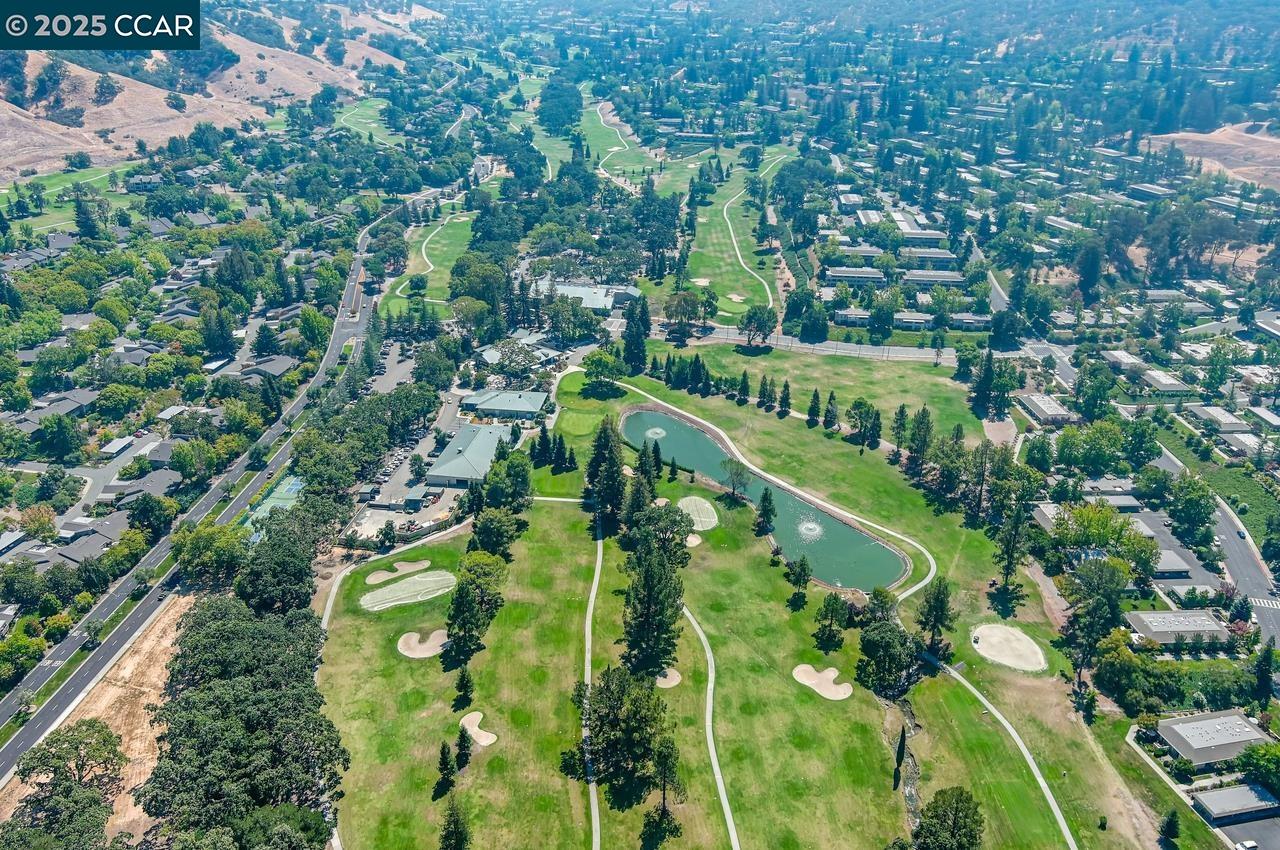 1400 Ptarmigan Drive, Unit 2 Walnut Creek, CA 94595 - Photo 40 of 44 an aerial view of residential houses with outdoor space