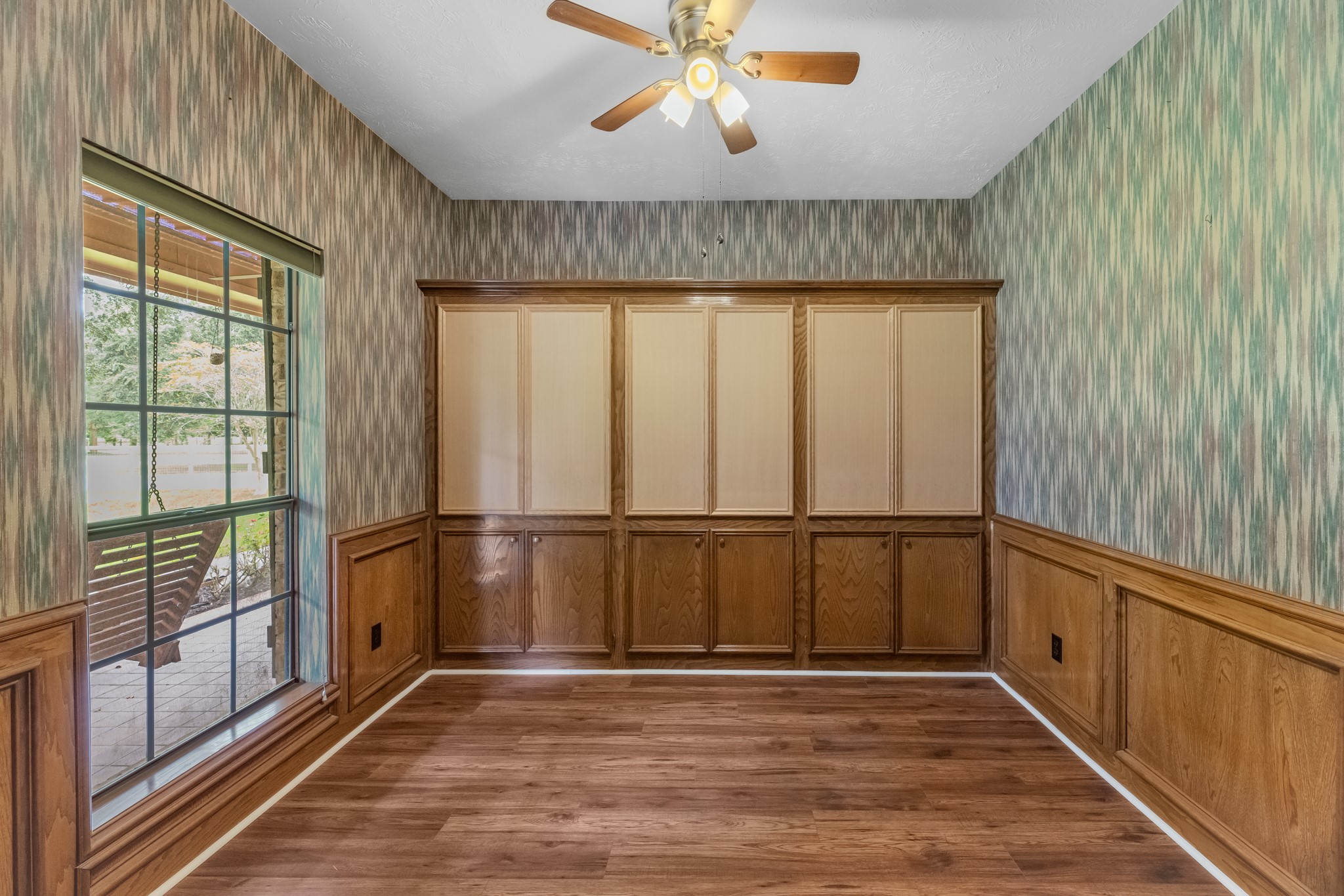 17126 County Road 39 Rosharon, TX 77583 - Photo 23 of 47 Study has wood doors that can be stained or pained. These are all really nice cabinets with shelving alomg the back wall.