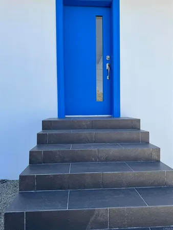 a view of staircase with white walls
