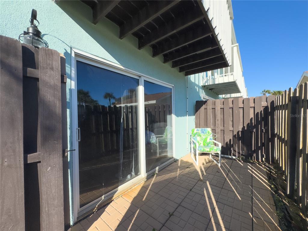 4786 South Atlantic Avenue, Unit 4B Ponce Inlet, FL 32127 - Photo 13 of 22 a view of balcony with wooden floor and outdoor seating