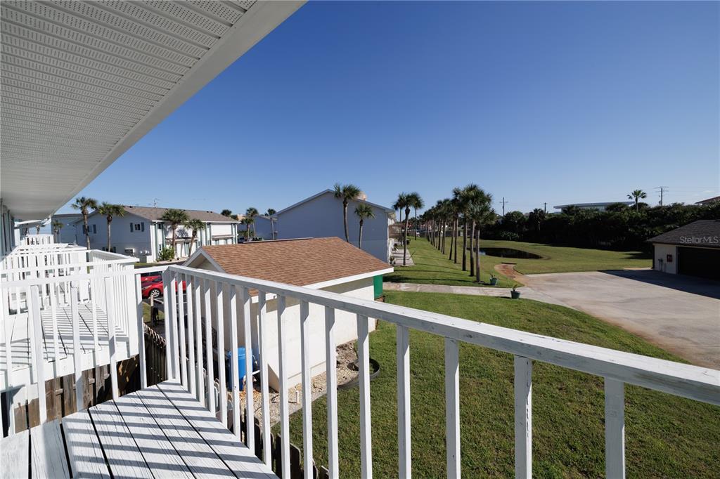 4786 South Atlantic Avenue, Unit 4B Ponce Inlet, FL 32127 - Photo 17 of 22 a view of a balcony and yard
