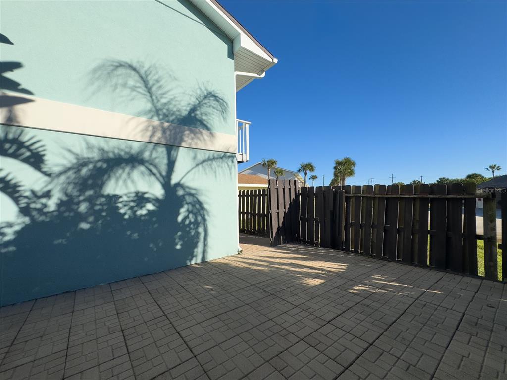 4786 South Atlantic Avenue, Unit 4B Ponce Inlet, FL 32127 - Photo 21 of 22 a view of a backyard