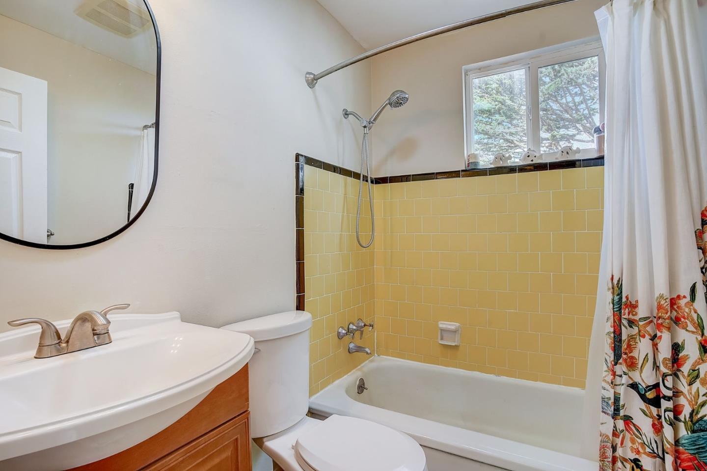 274 Hillside Drive Pacifica, CA 94044 - Photo 14 of 56 a bathroom with a sink and a mirror