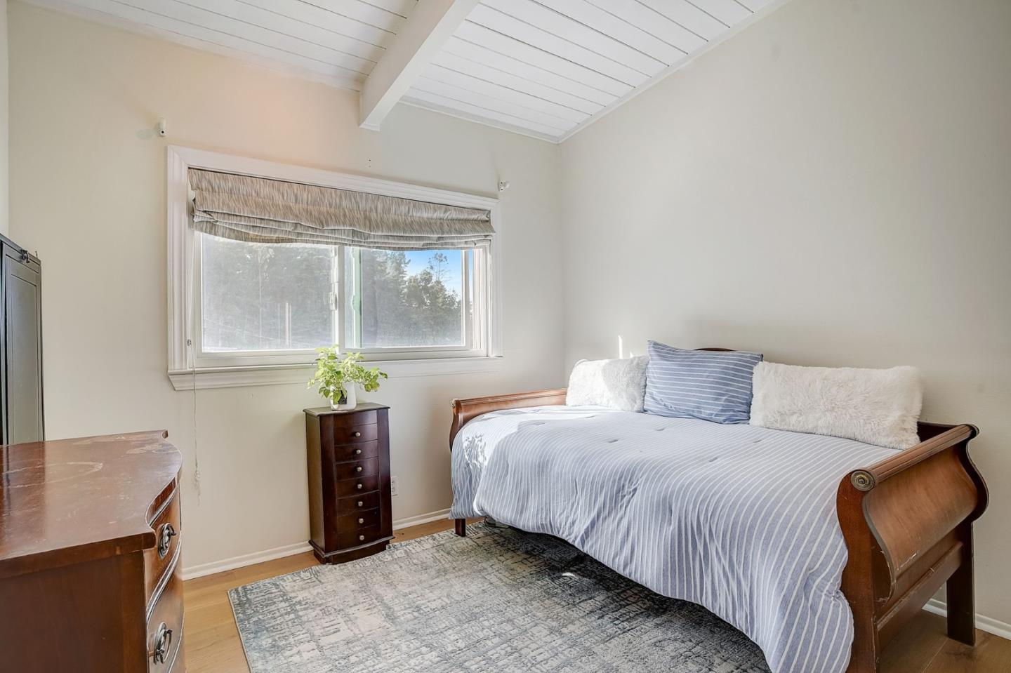 274 Hillside Drive Pacifica, CA 94044 - Photo 15 of 56 a bedroom with a bed and a table