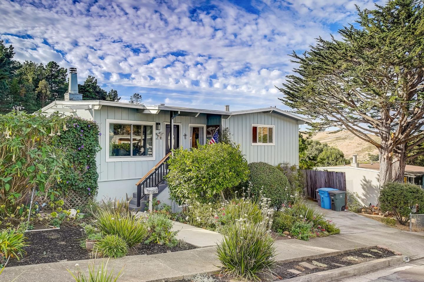 274 Hillside Drive Pacifica, CA 94044 - Photo 2 of 56 a front view of a house with a yard