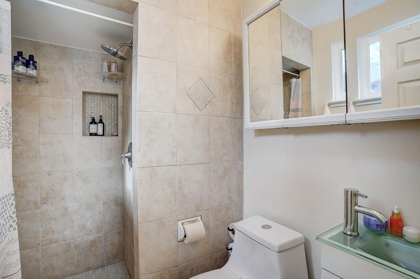 274 Hillside Drive Pacifica, CA 94044 - Photo 21 of 56 a bathroom with a toilet and a sink