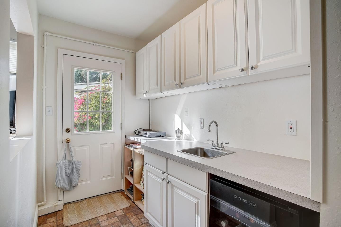 274 Hillside Drive Pacifica, CA 94044 - Photo 25 of 56 a kitchen with stainless steel appliances granite countertop a sink and a white cabinets