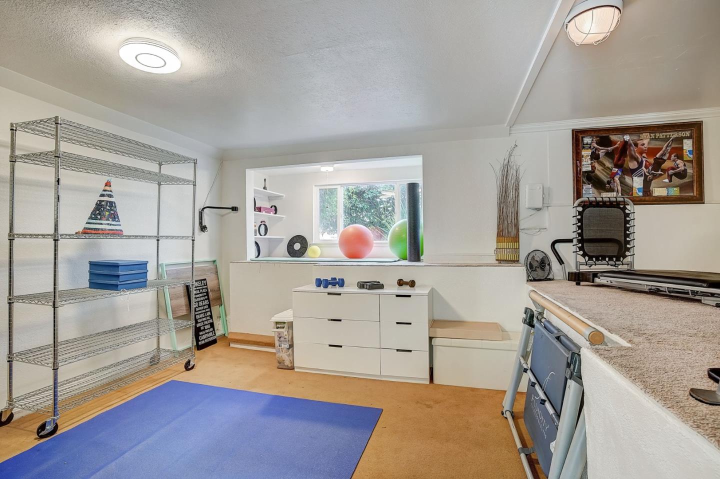 274 Hillside Drive Pacifica, CA 94044 - Photo 32 of 56 a spacious bedroom with a bed and a dresser