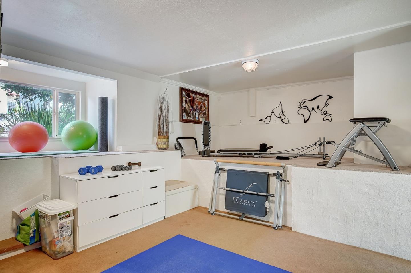 274 Hillside Drive Pacifica, CA 94044 - Photo 33 of 56 a view of cabinets a sink wooden floor and a window in a room