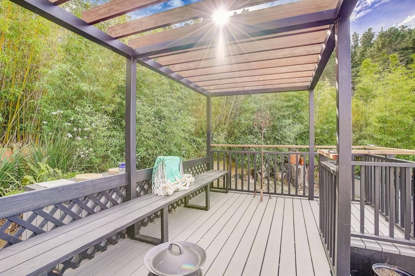 274 Hillside Drive Pacifica, CA 94044 - Photo 39 of 56 a balcony with wooden floor and outdoor seating