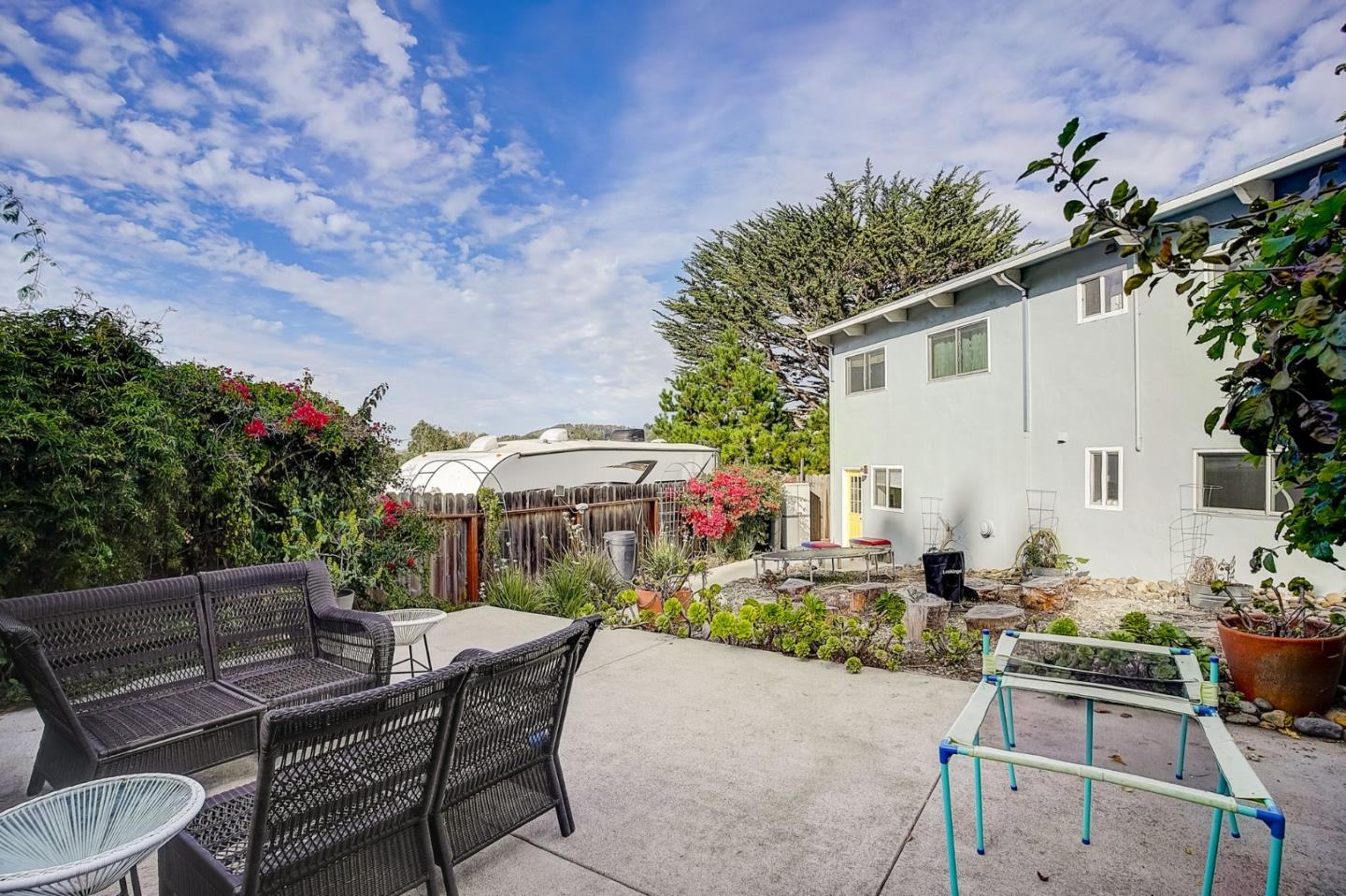 274 Hillside Drive Pacifica, CA 94044 - Photo 41 of 56 a view of backyard with outdoor seating a patio and plants