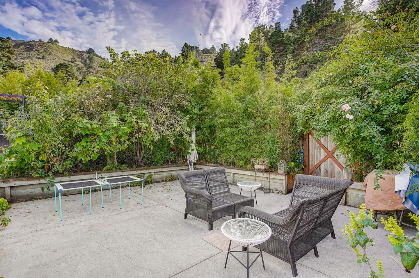 274 Hillside Drive Pacifica, CA 94044 - Photo 42 of 56 a view of backyard with seating area and trees