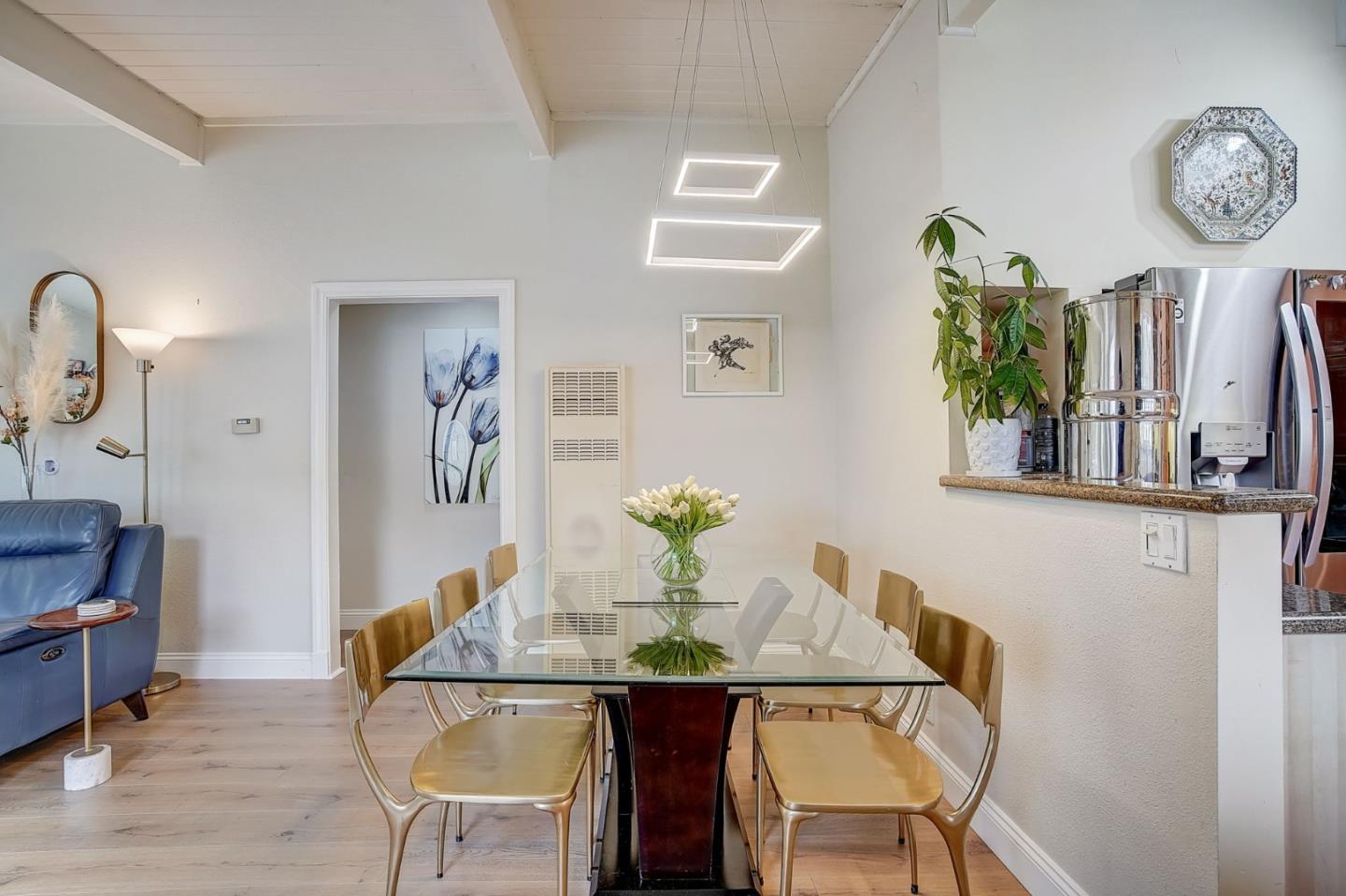 274 Hillside Drive Pacifica, CA 94044 - Photo 9 of 56 a view of a dining room with furniture and wooden floor
