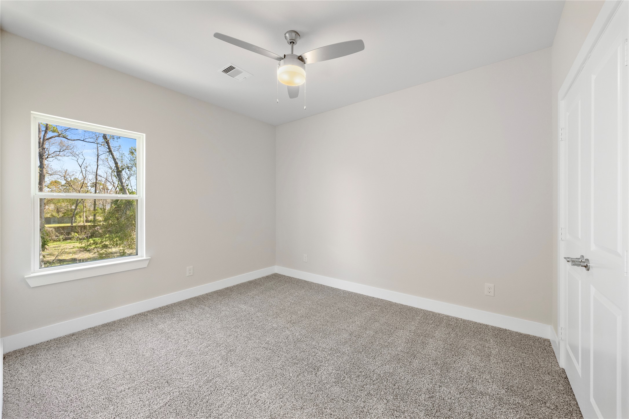6216 Carver Road Houston, TX 77091 - Photo 21 of 29 a view of an empty room with a window
