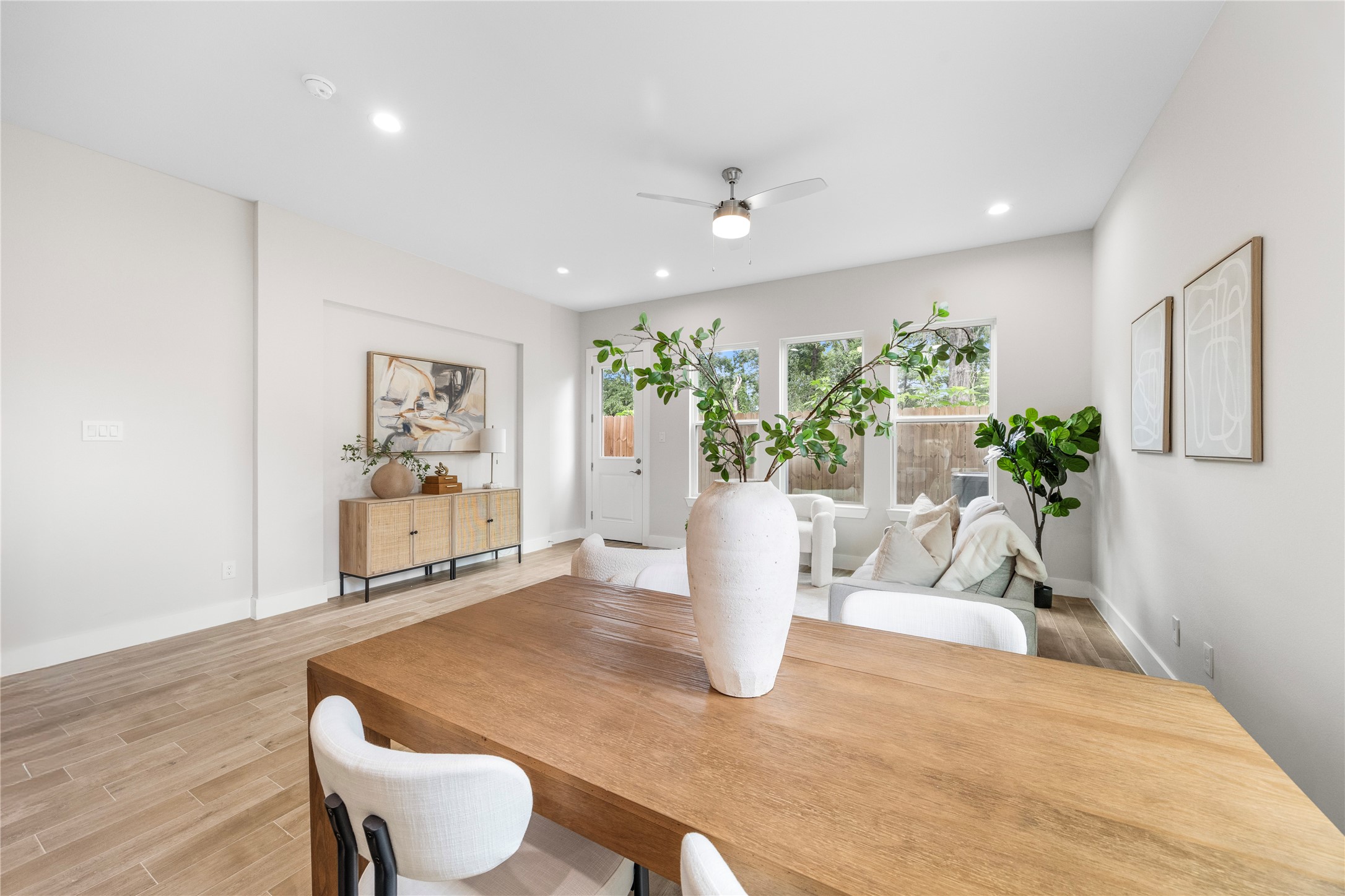 6216 Carver Road Houston, TX 77091 - Photo 7 of 29 a view of a dining room with furniture and a potted plant