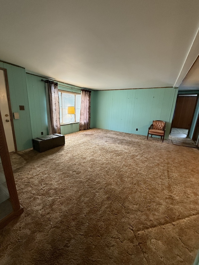 278 Blackthorn Road Matteson, IL 60443 - Photo 11 of 20 a view of a room with gym equipment and windows